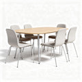 Oval dining table set with six upholstered chairs in light grey fabric
